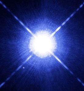 The brightest star in the night sky, Sirius A, and its white dwarf companion, Sirius B, imaged by the Hubble Space Telescope.